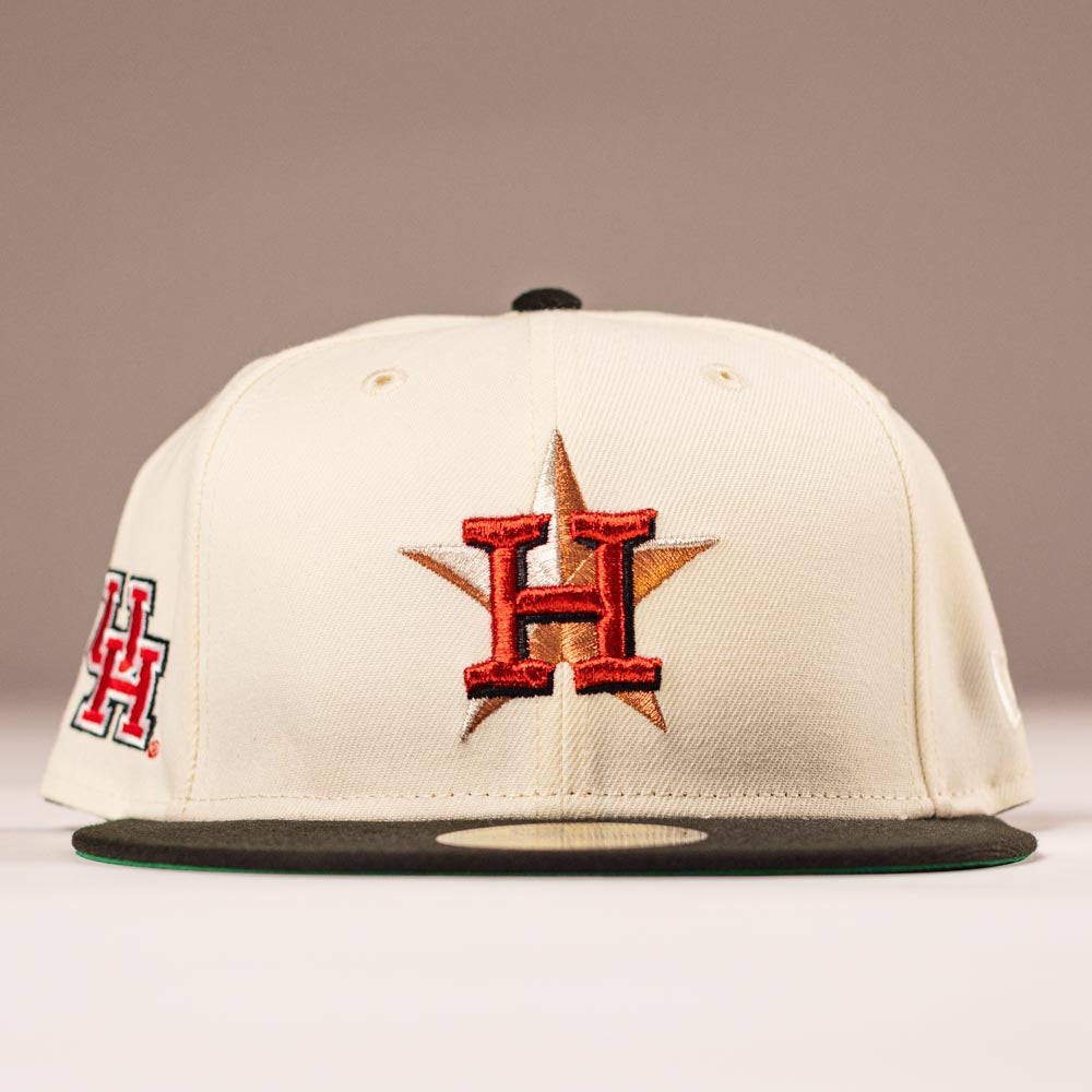 The Cougar 2.0 Houston Astros New Era Hat 5950 Fitted features a cream color, a red and black H with a gold star embroidered on the front, dark green brim, and side H logo for a standout look.