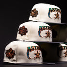 Four Undaground 22WS Chrome Houston Astros New Era Hat 5950 Fitted caps are stacked in a pyramid formation. Available at Chrome Undaground, these fitted hats showcase embroidered team logos and World Series patches, all set against a dark background with dramatic lighting emphasizing the intricate stitching details.