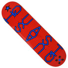 The Unicode 8.37x32.25 Quasi Skateboards Deck in red and blue features bold abstract shapes, a central shell design, and black geometric corner icons. Size: 8.375 x 32.25.