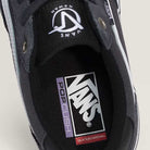 Close-up of the inside of a Vans Rowan Charcoal Gray VN0A5JICH911 suede skate shoe, highlighting the insole with Vans, PopCush, and Skateboarding text, as well as the Vans logo on the tongue. This durable skate shoe is part of the Suede Rowan Vans Shoes line.