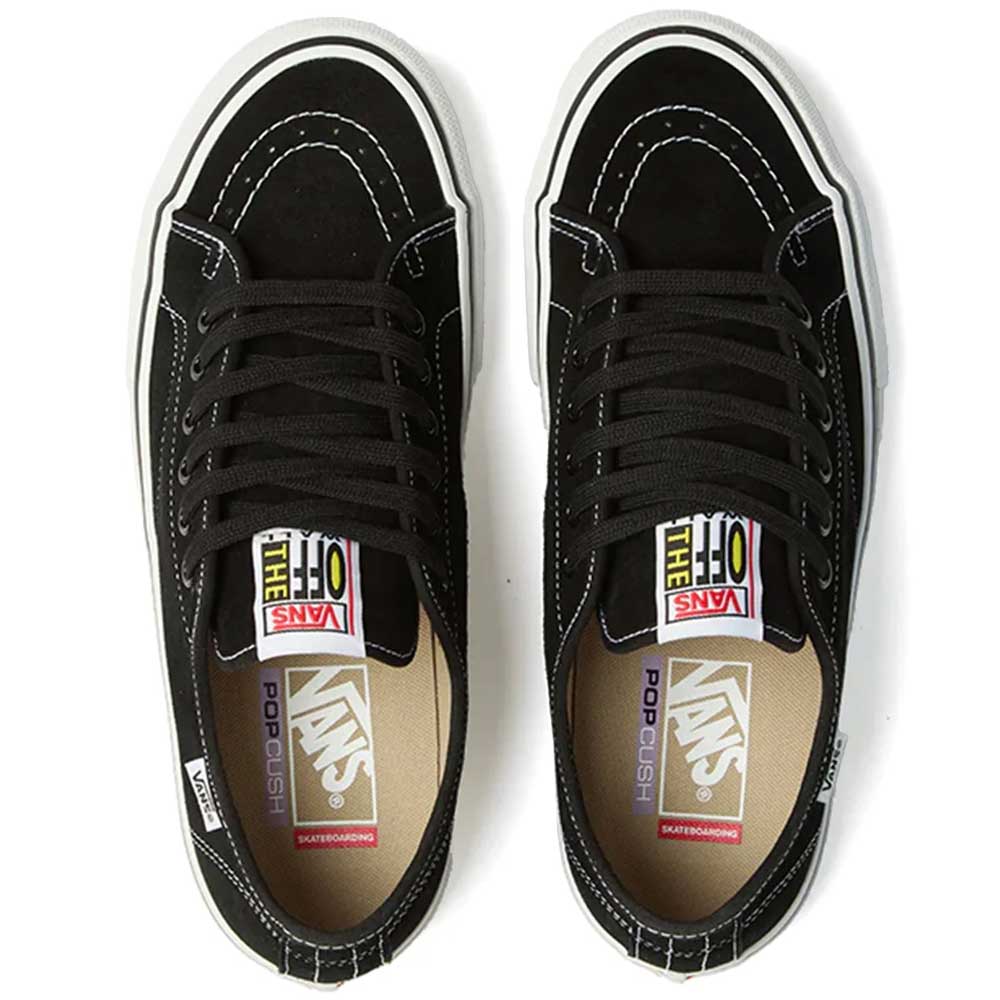 A pair of Vans Skate AVE Classic Black White VN000Y1NBA2 Suede Skateboard Shoes, featuring black suede uppers with white stitching, white soles, and black laces, viewed from above. The insoles display Vans PopCush footbeds branding and the tongues feature colorful Vans Off The Wall labels.