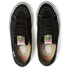 A pair of Vans Skate AVE Classic Black White VN000Y1NBA2 Suede Skateboard Shoes, featuring black suede uppers with white stitching, white soles, and black laces, viewed from above. The insoles display Vans PopCush footbeds branding and the tongues feature colorful Vans Off The Wall labels.