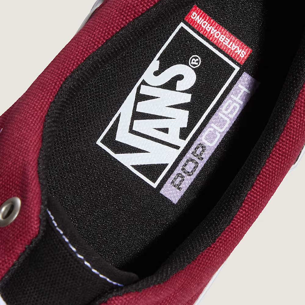 Close-up of the Vans Skate Era Black Dark Red VN000ECRBDK1 suede rubber shoe interior, featuring a black insole with white Vans logo, PopCush label, Skateboarding text by the heel, and a padded collar for comfort.