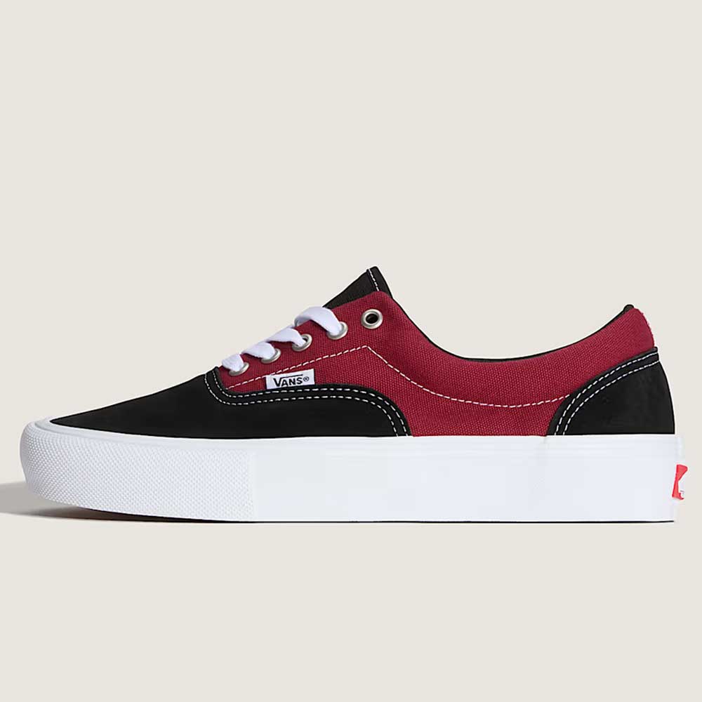 The Vans Skate Era Black Dark Red VN000ECRBDK1 features black and red suede, white laces, white stitching, a padded collar, and a thick white rubber sole, shown from the side on a plain beige background.