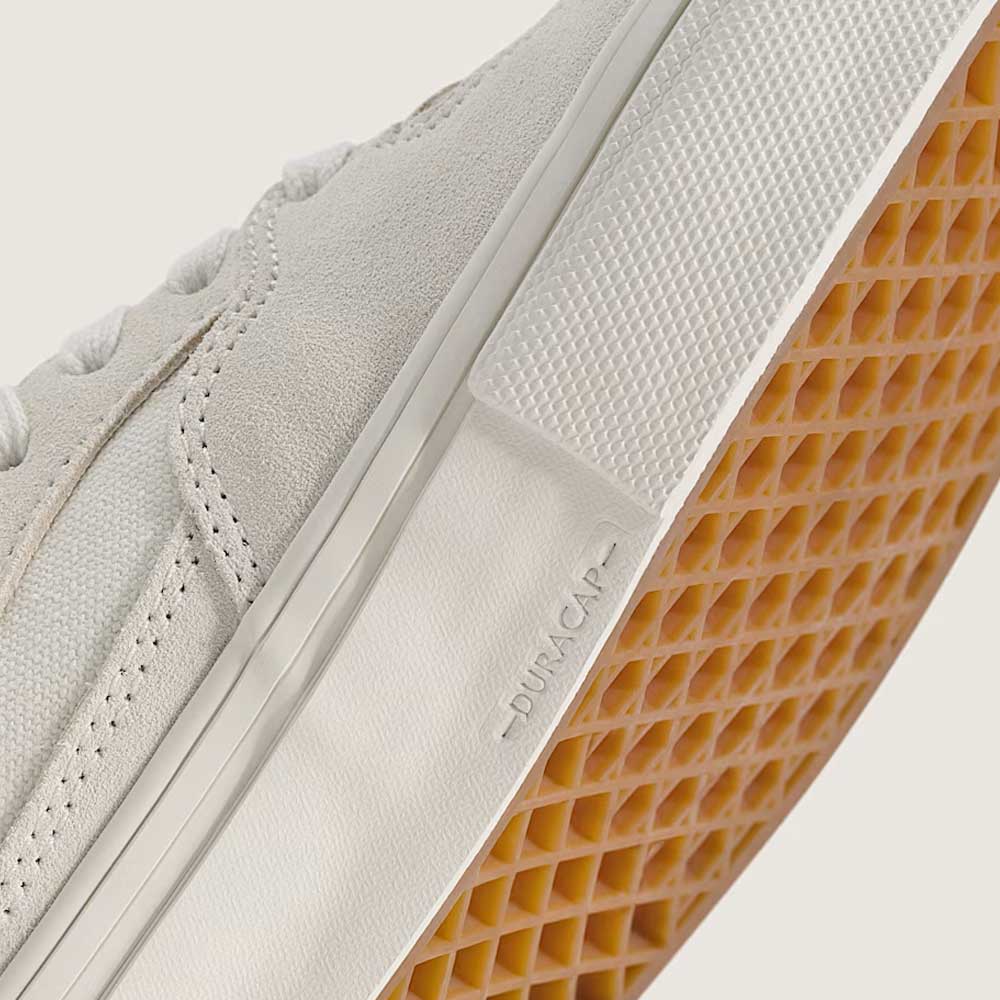 Close-up of the Vans Skate Half Cab Marshmallow White VN0A5FCDCA, featuring a suede upper, textured gum outsole, white stitching, DURACAP on the midsole, and PopCush impact protection.