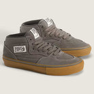 The Vans Skate Half Cab Walnut Gum VN0A5FCD77J1 suede skateboard shoes feature gray uppers, white labels, gray laces, brown gum soles, and PopCush impact protection, displayed on a light background.