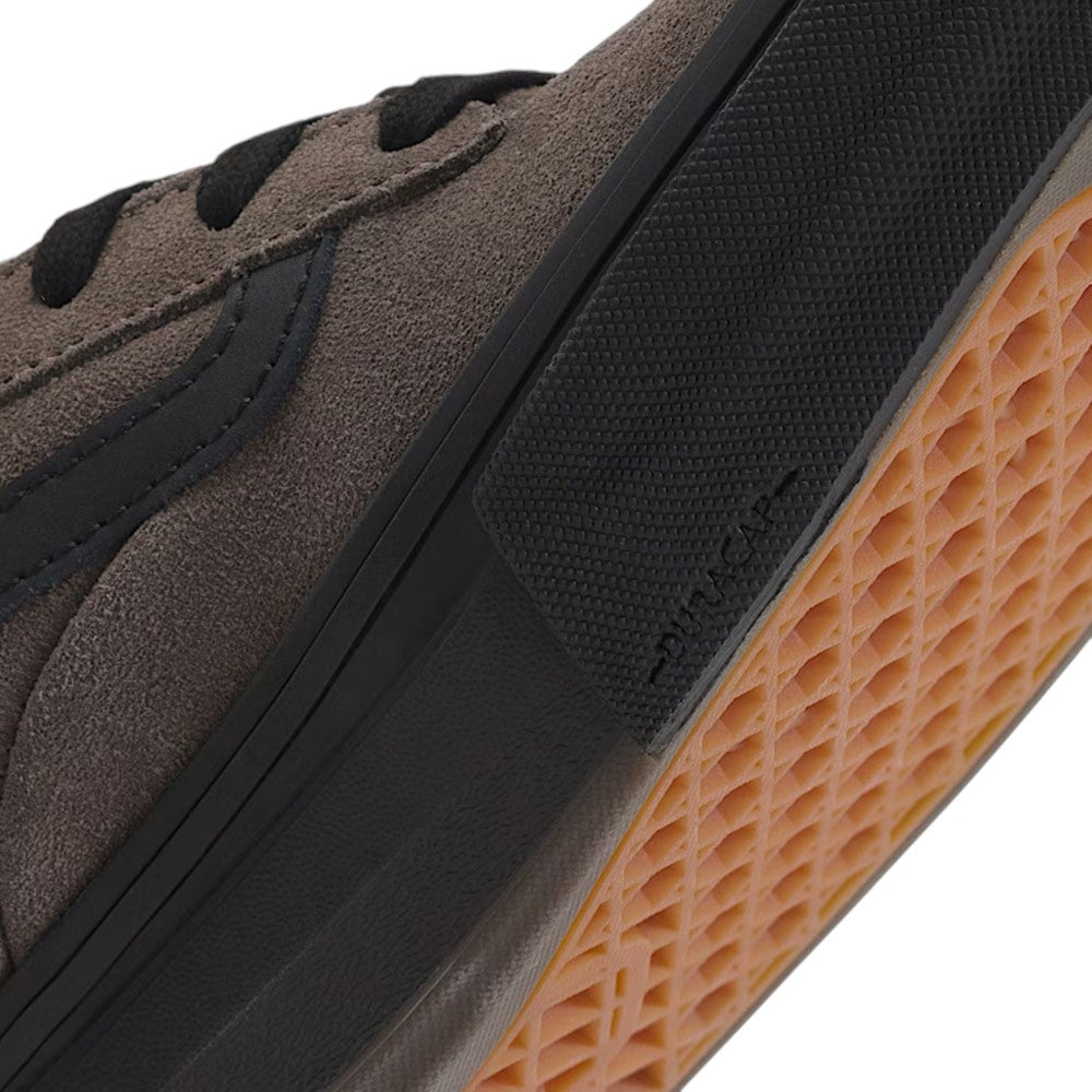 Close-up of a Vans Skate Kyle Walker Wafflecup Ripstop Bungee VN000DA49JC suede skate shoe with black laces and a black midsole featuring a textured rubber patch over a gum-colored waffle-patterned outsole.
