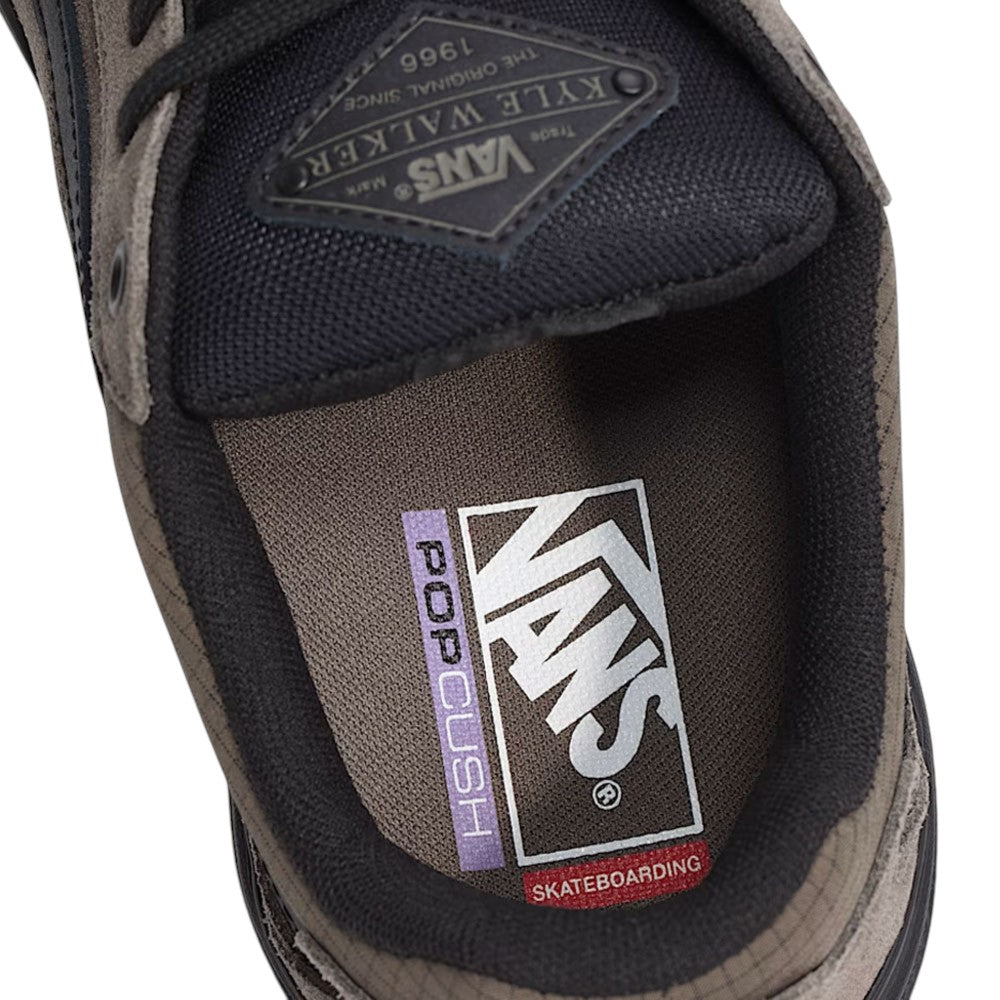 Close-up of the interior of a Vans Skate Kyle Walker Wafflecup Ripstop Bungee VN000DA49JC Suede Rubber Skateboarding Shoe, highlighting the branded PopCush insole and the matching tongue label.