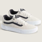 A pair of Vans Skate Kyle Walker Wafflecup White Gunmetal VN000DA4XQL1 suede rubber shoes featuring PopCush cushioning for added comfort, designed in white with black gunmetal accents, white laces, and a black side stripe—displayed on a light background.