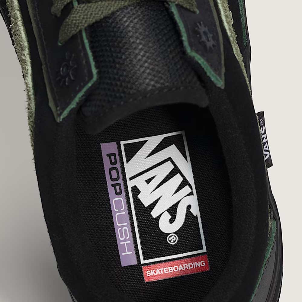 Close-up of the inside of Vans Skate Half Cab Walnut Gum VN0A5FCD77J1 suede skateboard shoe, featuring the “Vans” logo and “PopCush” insole label with green and black details that highlight PopCush impact protection.