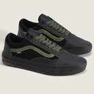 The Vans Skate Half Cab Walnut Gum VN0A5FCD77J1 features black soles and uppers, olive green suede side stripes and laces, and PopCush impact protection—ideal skateboarding shoes shown on a light background.
