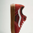 A close-up side view of the Vans Skate Rowan Z3 VN000V74BRD Gum Bordeaux Suede Skateboard Shoes with white laces, stripe detail, brown accents, and a gum sole featuring impact protection, set against a plain light background.