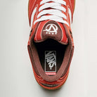 Top view of Vans Skate Rowan Z3 VN000V74BRD Gum Bordeaux Suede skateboard shoe with white laces, visible Vans logo on tongue and insole, plus partially visible gum sole at the bottom for impact protection.