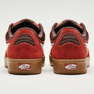 The Vans Skate Rowan Z3 VN000V74BRD Gum Bordeaux Suede Skateboard Shoes feature red uppers, brown suede accents, gum soles, and display the Vans Off The Wall logo on the heel tabs for superior impact protection.