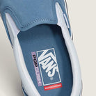 Close-up of the inside of the Vans Skate Slip On VN000EG5DSB1 Dusty Blue Suede shoe, showcasing the Vans, PopCush, and Skateboarding logos on the insole—emphasizing its skateboarding performance features.