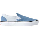 A Vans Skate Slip On VN000EG5DSB1 Dusty Blue Suede shoe, featuring a blue and white design with a white sole, small blue side accents, and a red tag on the heel, shown from the side against a plain white background.