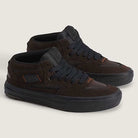 The Vans Wafflecup Half Cab Rizzo Brown Black VN000D9ZY491 suede skate shoes feature black suede and canvas uppers, black laces and soles, subtle orange details, and signature WaffleCup construction on a light beige background.