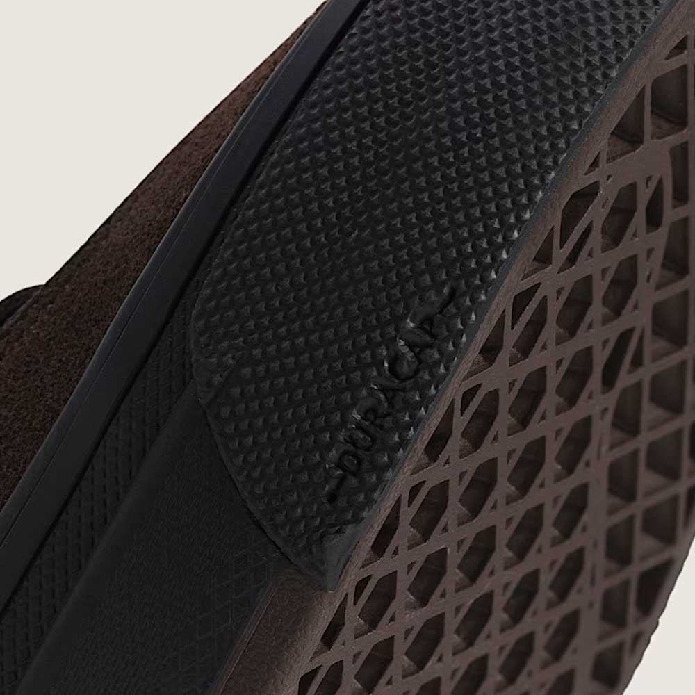 Close-up of the Vans Skate Half Cab Walnut Gum VN0A5FCD77J1 Suede Skateboard Shoe's textured rubber sole, highlighting its diamond-patterned grip, PopCush impact protection, and the VANS logo embossed near the edge.