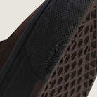 Close-up of the Vans Skate Half Cab Walnut Gum VN0A5FCD77J1 Suede Skateboard Shoe's textured rubber sole, highlighting its diamond-patterned grip, PopCush impact protection, and the VANS logo embossed near the edge.