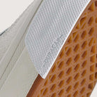 Close-up of the Vans Skate Half Cab Walnut Gum VN0A5FCD77J1 showing its textured gum rubber sole, grey suede upper, reinforced white DURACAP outsole, and PopCush impact protection—ideal features for skateboard shoes.