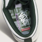 Top view of the Vans Skate Half Cab Walnut Gum VN0A5FCD77J1 Suede Skateboard Shoe’s white heel with a green collar, showing the Vans logo, PopCush impact protection, and "Skateboarding" text on the insole.