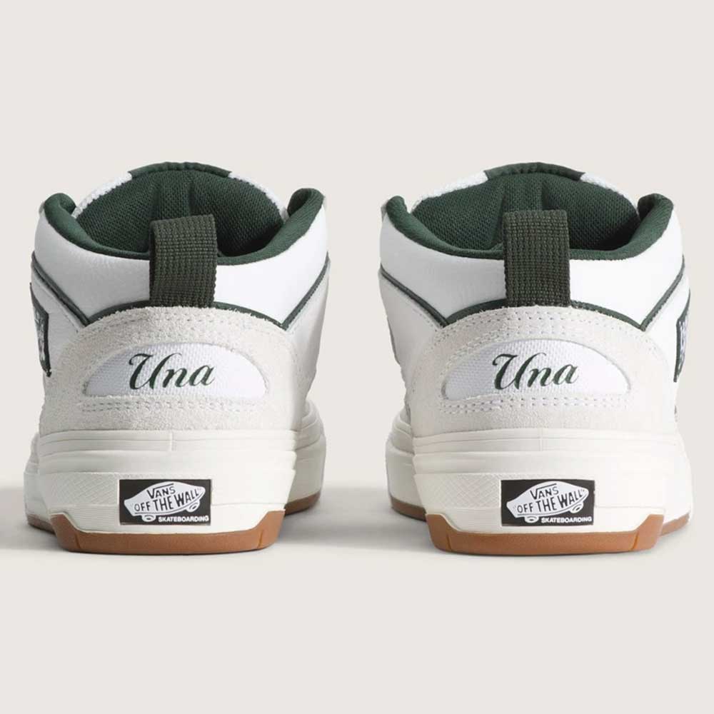 A pair of Vans Skate Half Cab Walnut Gum VN0A5FCD77J1 suede skateboard shoes shown from the back, each heel featuring "Una" above the Vans Off the Wall logo on the sole, perfect for sessions with PopCush impact protection.