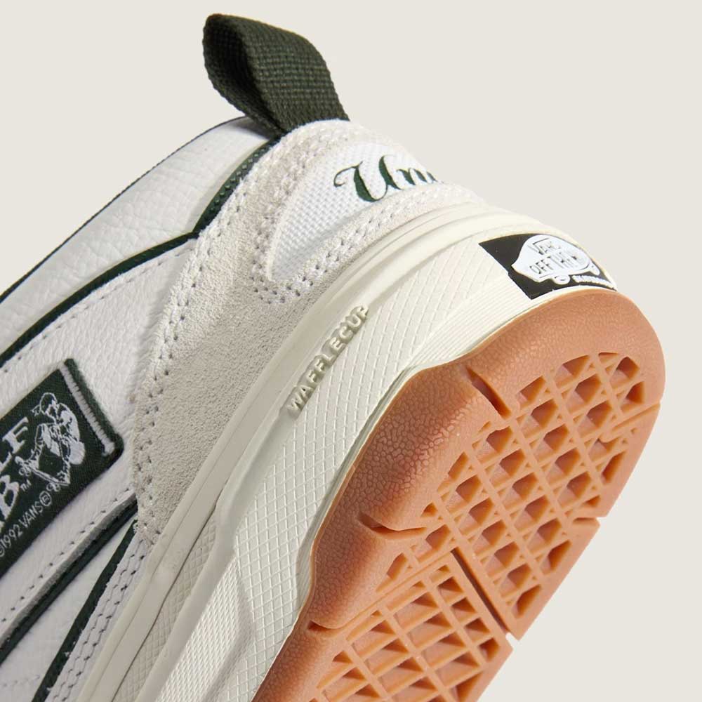 Close-up of the heel and sole of Vans Skate Half Cab Walnut Gum VN0A5FCD77J1 Suede Skateboard Shoes, highlighting the textured gum outsole, WAFFLECUP midsole label, PopCush cushioning, and embroidered plus printed branding.