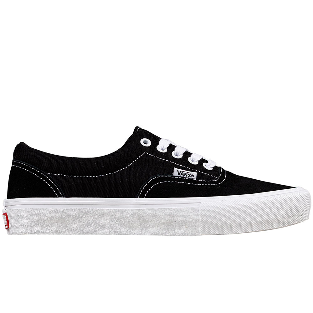 The Skate Era Black White VN000ECRBA21 Vans shoe features black suede, white laces and stitching, a thick white rubber sole, and is designed for skateboard durability. Side view.
