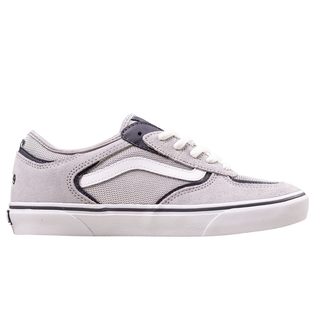 The VN000DA25TC1 Skate Rowley Multi Vans Suede Skateboarding Shoe features light gray suede, white laces, a white wavy side stripe, dark gray accents, and a white rubber sole. Geoff Rowley-inspired and shown in profile on a white background.
