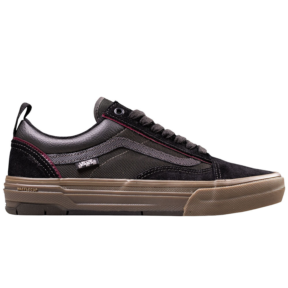 The Vans Wafflecup Old Skool Black Dark Gum VN000EB739L1 Suede Skate Shoe features a black upper with dark gray mesh, suede accents, burgundy stitching, a white Vans tag, and a brown rubber sole. Shown in right-facing side profile.