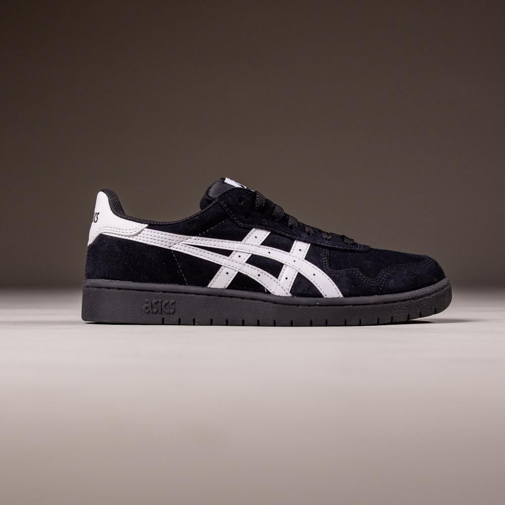 A Japan Pro Asics Black White 1201A92001 suede skateboarding shoe featuring a black upper, white logo, and detailing, shown side-on against a neutral background.