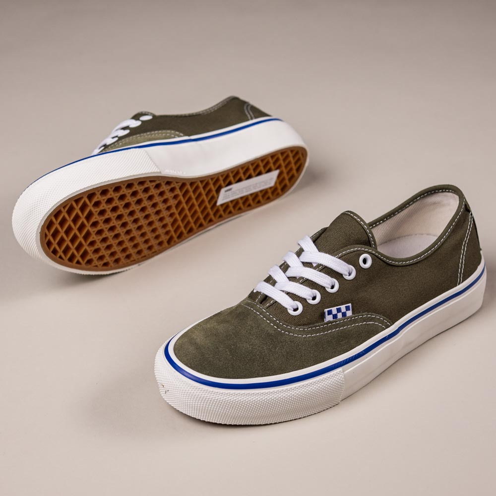 The Suede Canvas Mossy Olive Authentic VN0A5FC8FR11 Vans Skate Skateboarding Shoes feature olive green canvas, white laces and soles, blue accents near the sole, and gum rubber waffle-pattern outsoles displayed on a neutral background.