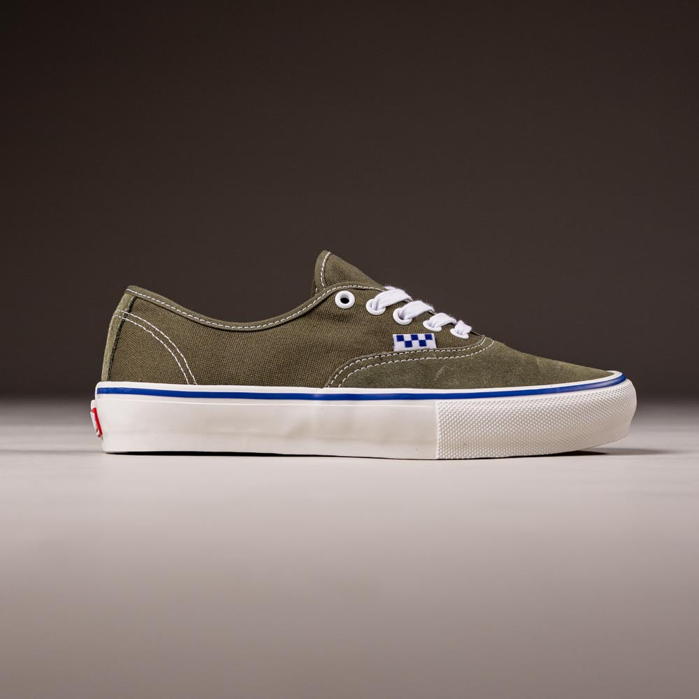 A single Suede Canvas Mossy Olive Authentic VN0A5FC8FR11 Vans Skate Skateboarding Shoe with white laces, stitching, a blue and white checkerboard logo, and white sole is shown in profile against a plain dark background.