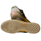 A pair of Vans Skate Ave 2.0 Sage VN000DA1SAG1 suede skateboarding shoes: one shoe is displayed sole-up to show the textured UltimateWaffle, while the other highlights its beige, black, and tan design with a red and white heel tag.