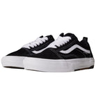 A pair of Vans Wafflecup Old Skool Black White VN000EB7BA2 suede skate shoes featuring a black and white low-top design, white laces, white soles, and a curved white stripe on the side, displayed side by side against a plain background.