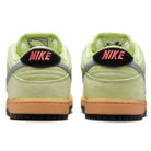 Back view of the Verdugo Mountain Dunk Low Pro HQ1626300 Nike SB suede shoes in Light Liquid Lime/Wolf Grey/Black, featuring gum soles, black heel tabs, bright pink NIKE text on the back, grey accents, and a soft suede finish.