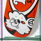 The Verdy Oval 8.06 Real Skateboard Deck Skateshop Day features bold orange, red, and white colors with a cartoon cloud character by VERDY and abstract green and purple brushstrokes for this exclusive release.