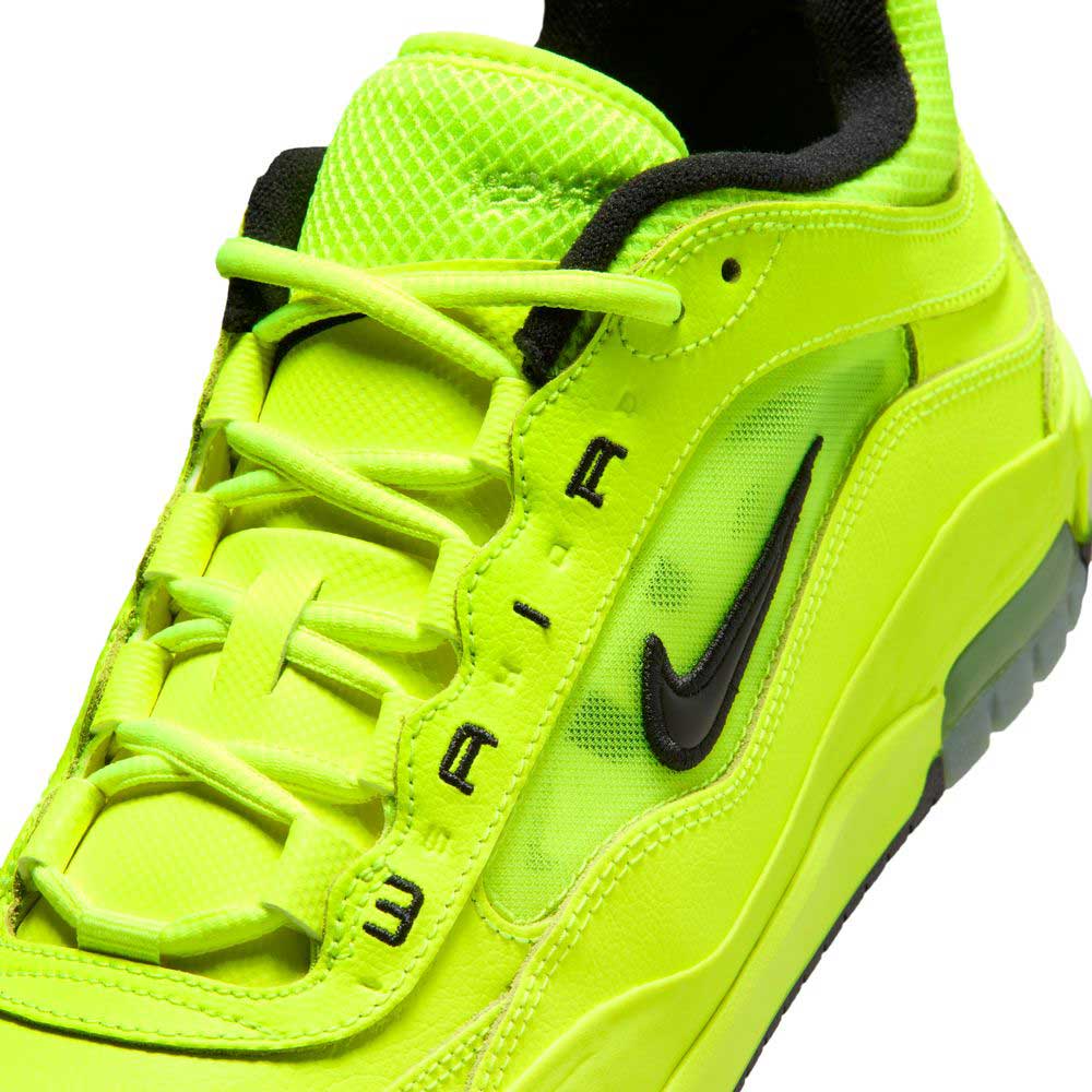A close-up of the Volt Black IB6212701 Air MAX Ishod Nike SB Skateboarding Shoes, featuring bright neon green with black accents, mesh and leather uppers, Nike swoosh, AIR lace detail, and Max Air cushioning for comfort.