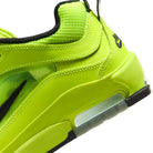Close-up of the Volt Black IB6212701 Air MAX Ishod Nike SB Skateboarding Shoe with black accents, showing visible Max Air cushioning and textured mesh and leather on the heel and side.