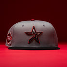 Days B4 WS05 Misty Black Houston Astros New Era 59FIFTY fitted hat, featuring a gray crown with a Misty Black brim, a large outlined Astros star logo on the front, and a side patch, displayed against a red background.