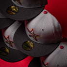 Days B4 WS05 Misty Black Houston Astros New Era Hat 5950 Fitted caps—featuring gray and black colorways, gold stickers, and a red, black, and white star logo—are arranged on a Misty Black red background.