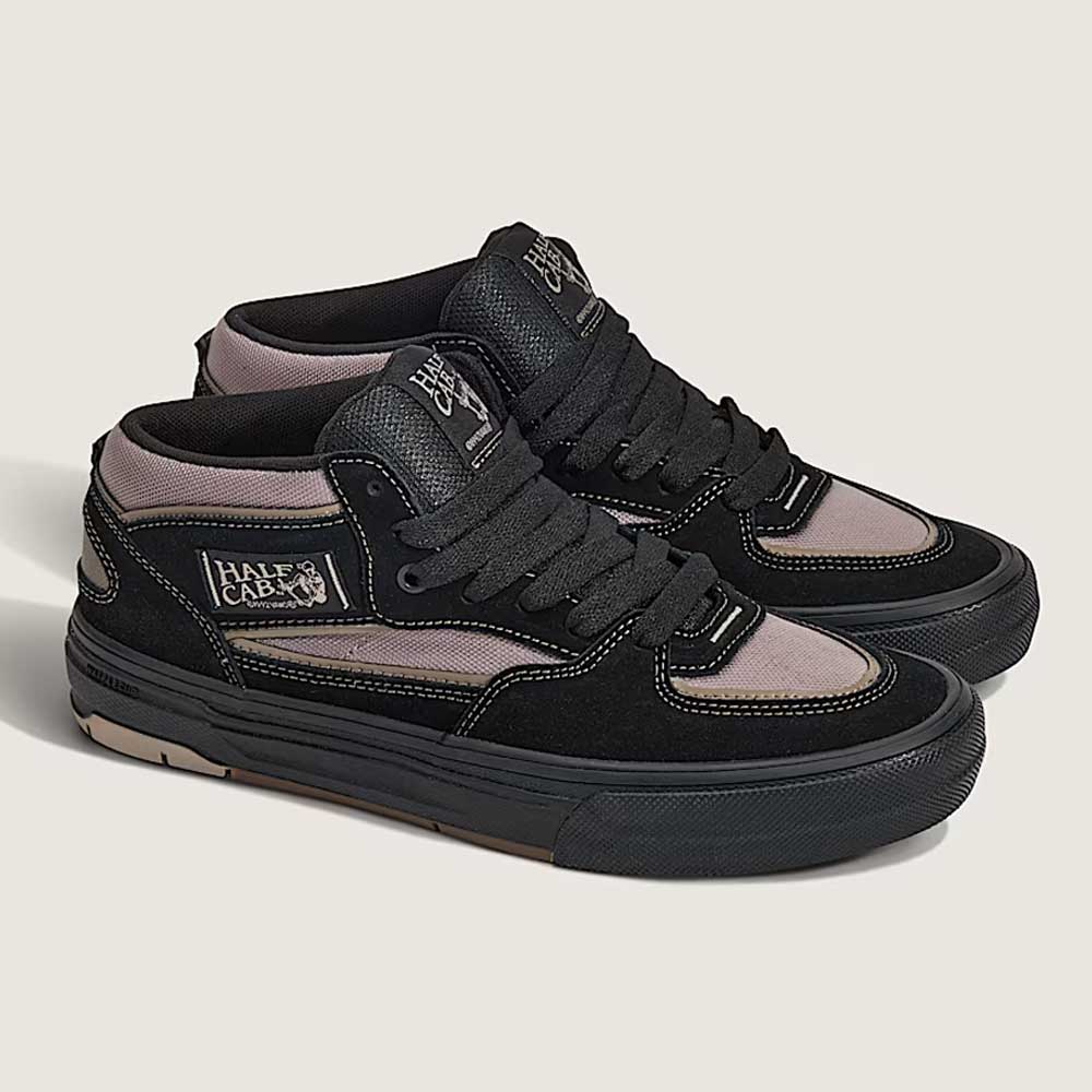 The Vans Wafflecup Half Cab Black Peyote VN000D9ZOUK1 suede skate shoes feature black and gray suede and canvas uppers, black laces, and a black WaffleCup sole, shown on a light background.