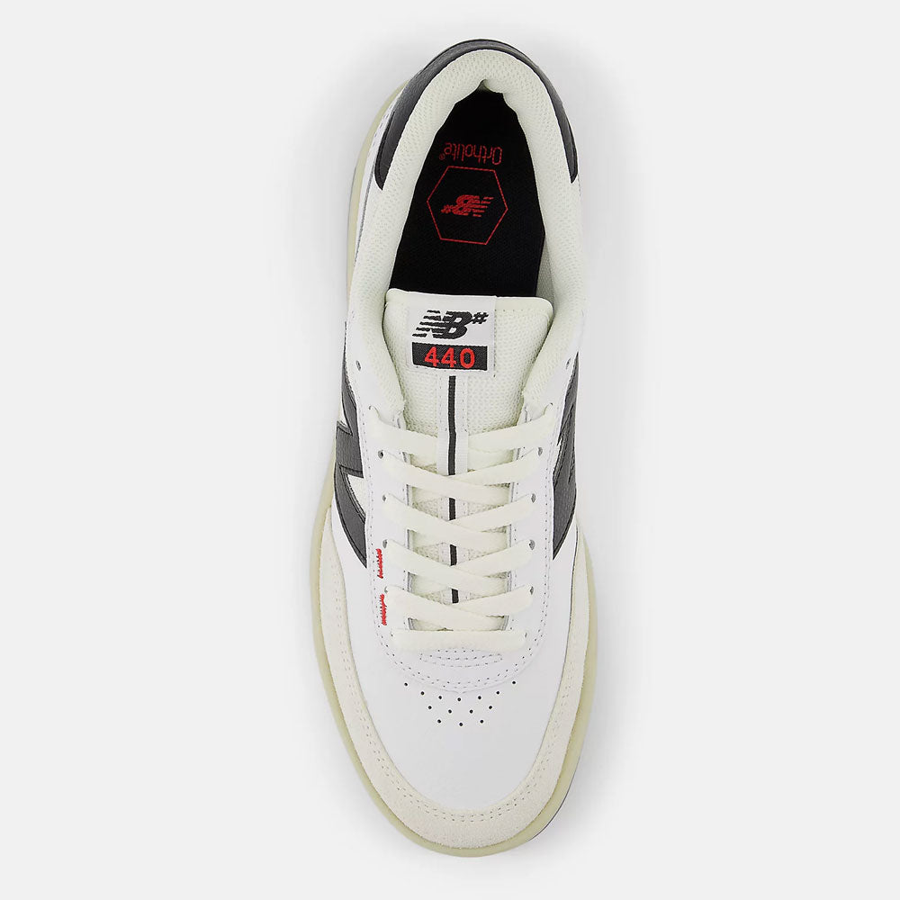 Top view of durable White Black 440 NO2 New Balance Numeric Suede Skateboarding Shoes, featuring black accents, red 440 tongue label, perforated toe box, ABZORB midsole, white laces, and a light-colored sole on a white background.