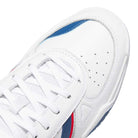 Close-up of the White Brown Tekkira HQ4814 Adidas Skateboarding shoes, featuring suede leather, white laces, perforated toe box, and blue and red side accents for style and comfort.