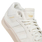 A close-up of the White White KJ0192 Tyshawn Adidas Skateboarding Leather Shoes showcases the gold TYSHAWN lettering, white laces, and Adidas logo on the tongue, emphasizing their premium leather upper that distinguishes these shoes as top-tier skateboarding footwear.