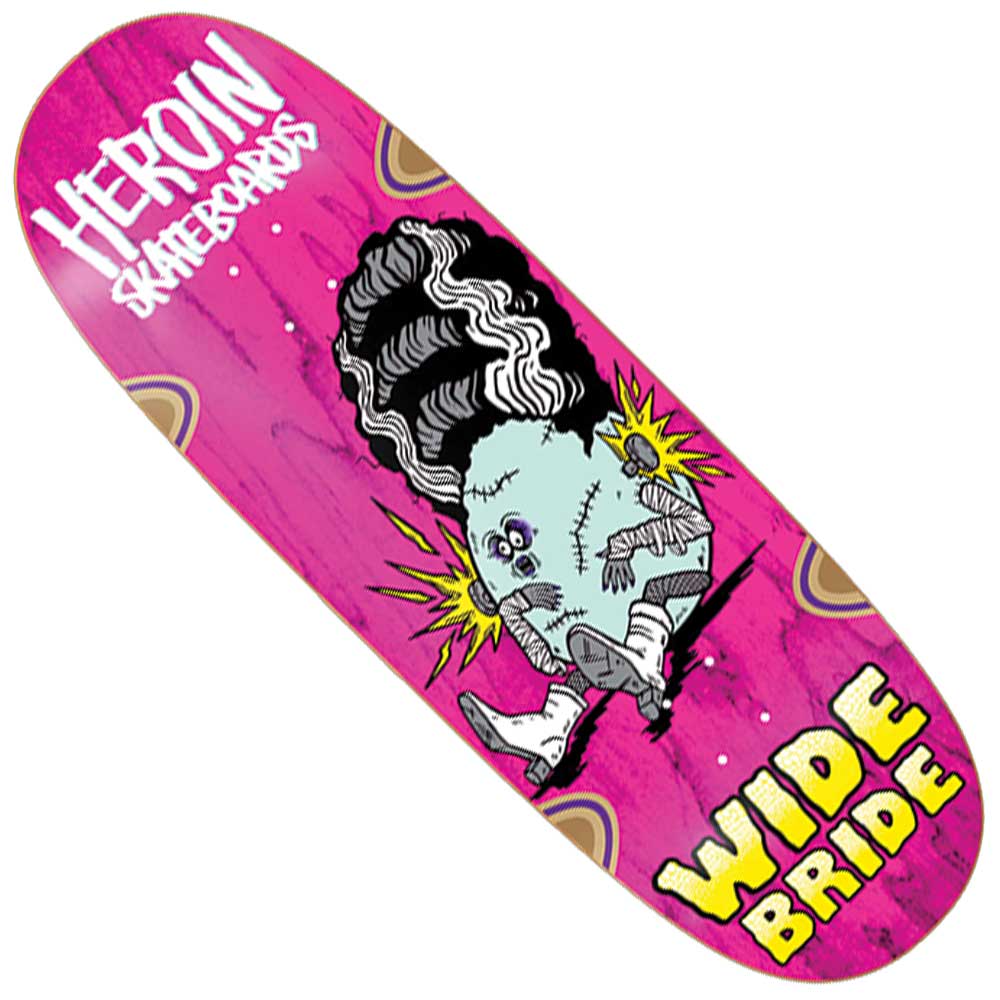 A Wide Bride 10.4 Heroin Skateboards Deck Shaped in pink showcases a cartoon bride with bandages and wild hair, featuring bold yellow and white text reading “HEROIN SKATEBOARDS” at the top and “WIDE BRIDE” at the bottom.