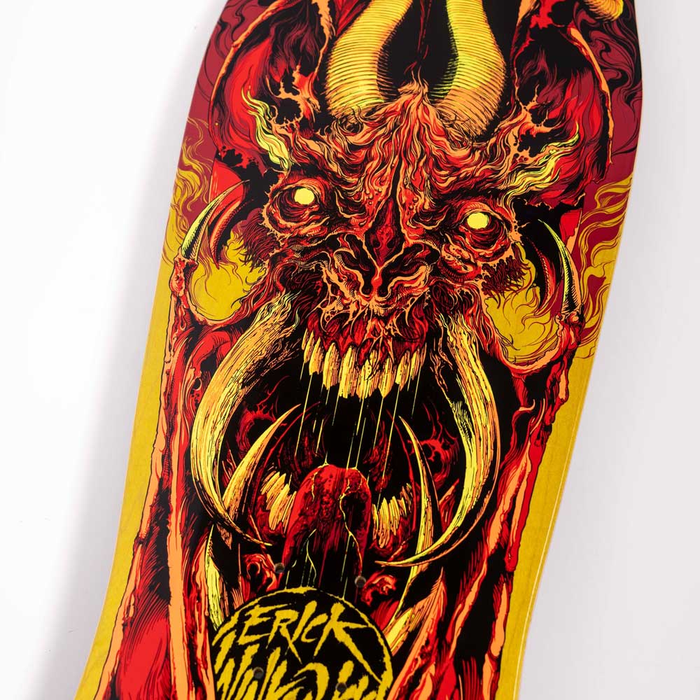 Close-up of the Winkowski Primeval Pro Shaped 10.34in x 30.54in Santa Cruz Deck, featuring vivid artwork of a demonic face with horns, sharp teeth, glowing eyes in red, yellow, and black; “Winkowski Primeval” appears at the bottom.