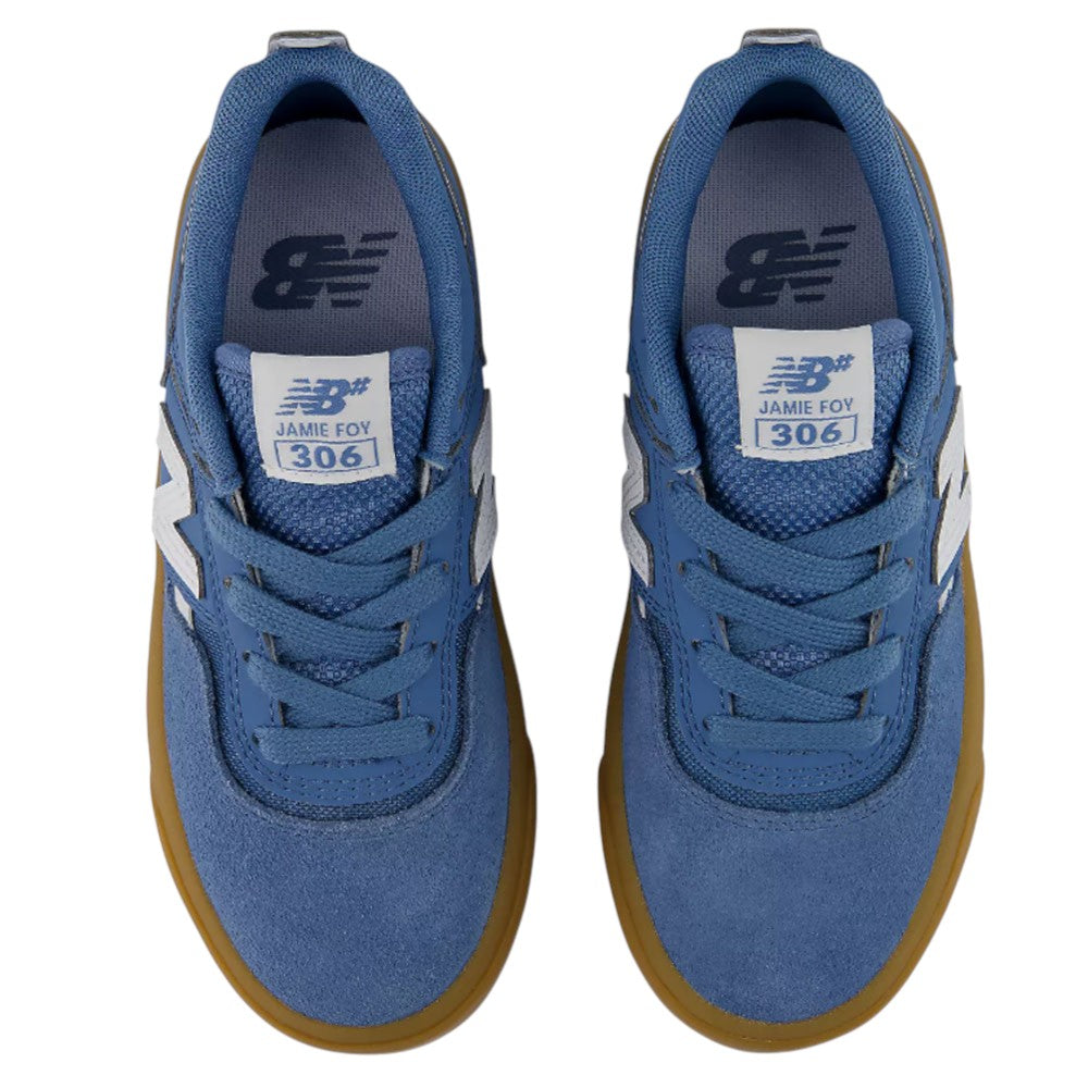 A pair of blue YOUTH Jamie Foy Cup 306 CAR New Balance Numeric Suede Skateboarding Shoes with gum soles, viewed from above. The tongues feature the Jamie Foy 306 label, showcasing these as durable skate shoes designed for the youth skate scene.