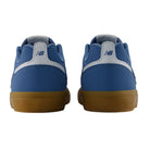 A pair of blue YOUTH Jamie Foy Cup 306 CAR New Balance Numeric Suede Skateboarding Shoes viewed from the back, featuring white accents and gum-colored soles—these durable sneakers are inspired by youth skate shoes, combining style and performance.