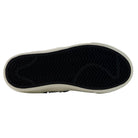The image shows the black rubber sole of the YOUTH Jamie Foy Cup 306 TWY New Balance Numeric Suede Skateboarding Shoes, featuring a white outer edge. The tread pattern consists of zigzag and wavy lines, designed for excellent grip—ideal for a kids’ skate shoe inspired by pro skater Jamie Foy.